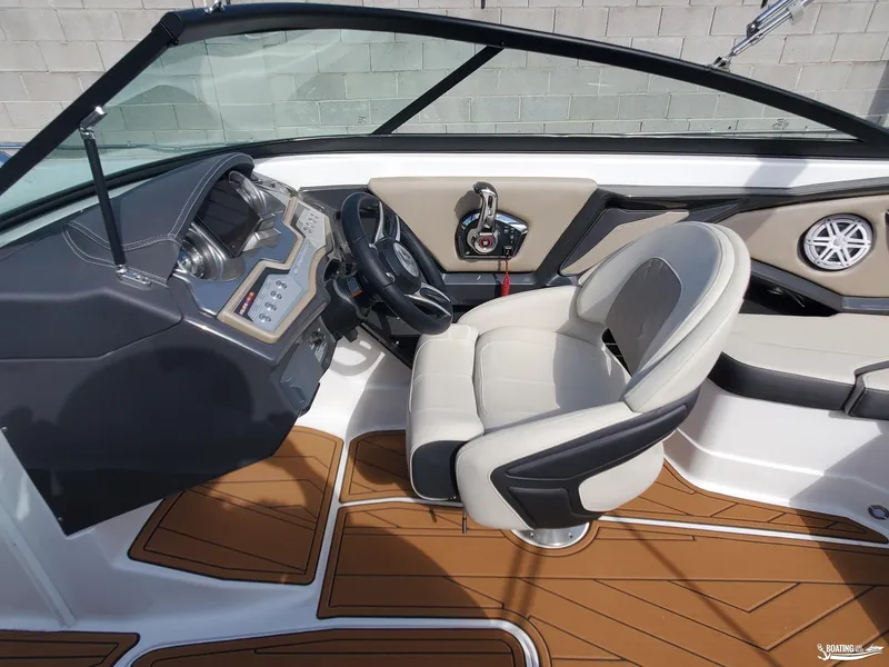 Slide: The Image of 2023 Monterey 238SS boat interior with modern dashboard and comfortable seating. - 16