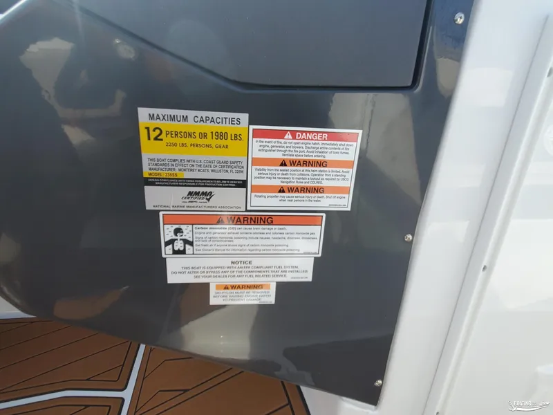 Slide: The Image of Warning labels on 2023 Monterey 238SS boat, indicating maximum capacity and safety instructions. - 18