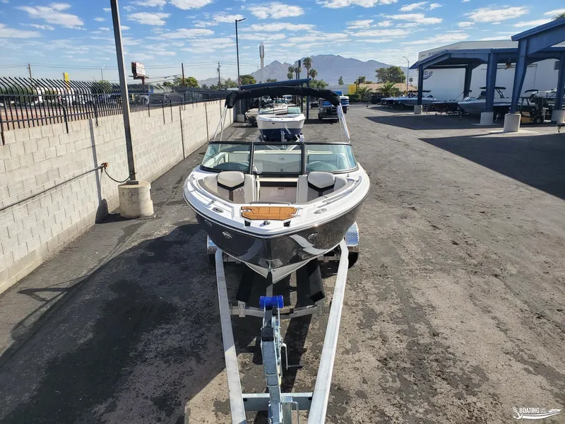 Slide: The Image of 2023 Monterey 238SS boat on trailer in outdoor storage facility. - 2