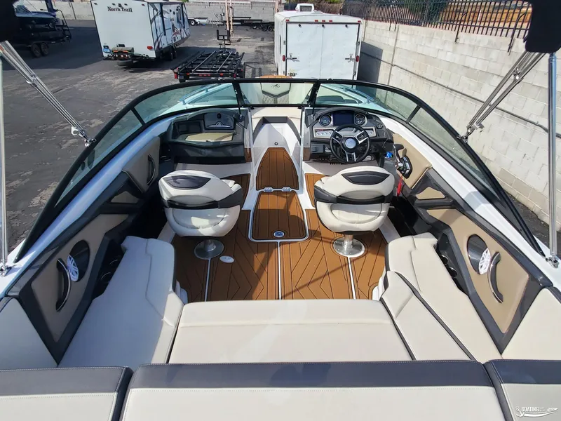 Slide: The Image of 2023 Monterey 238SS boat interior with modern seating and dashboard. - 9