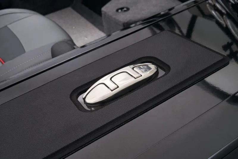 Slide: The Image of 2023 Tracker Targa V-19 WT storage compartment with safety equipment. - 50