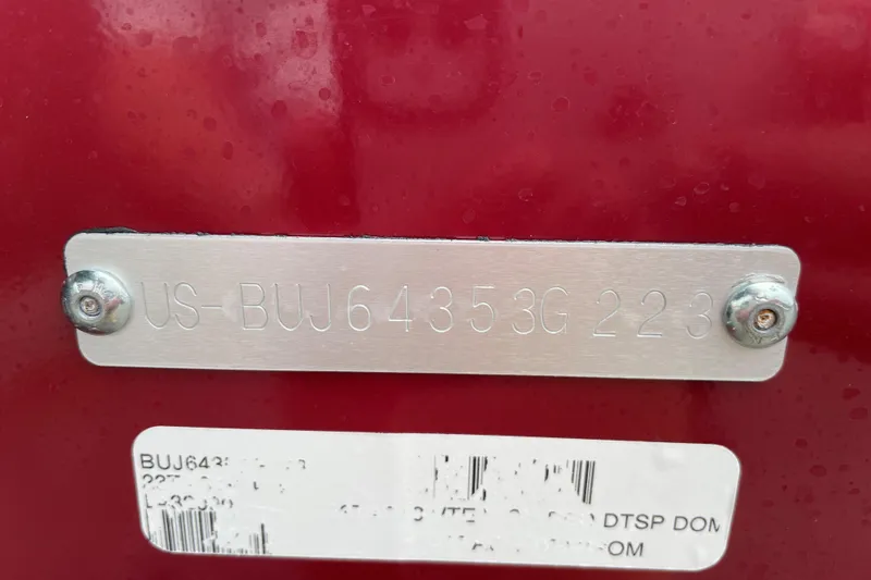 Slide: The Image of 2023 Tracker Targa V-19 WT identification plate with serial number on red background. - 76