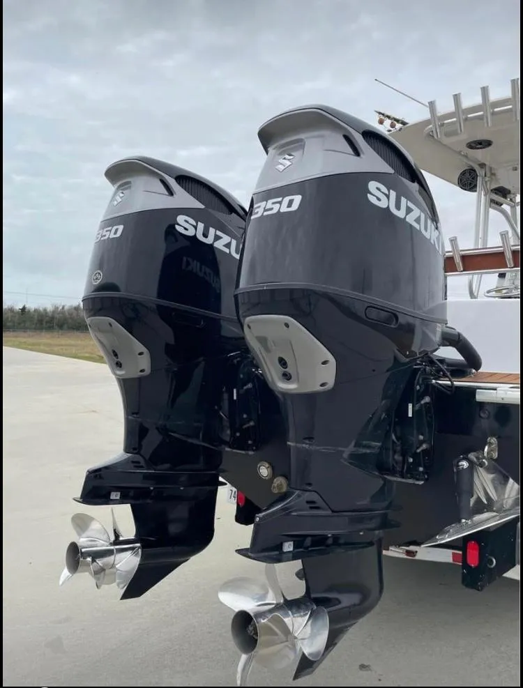 Slide: The Image of Twin Suzuki 350 outboard motors on a 1986 Custom 38 Coyote boat. - 5