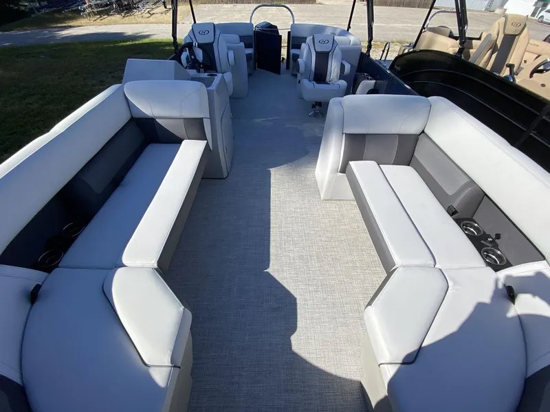 Slide: The Image of 2023 Harris Cruiser 230 CWDH pontoon boat with spacious seating and modern interior. - 11
