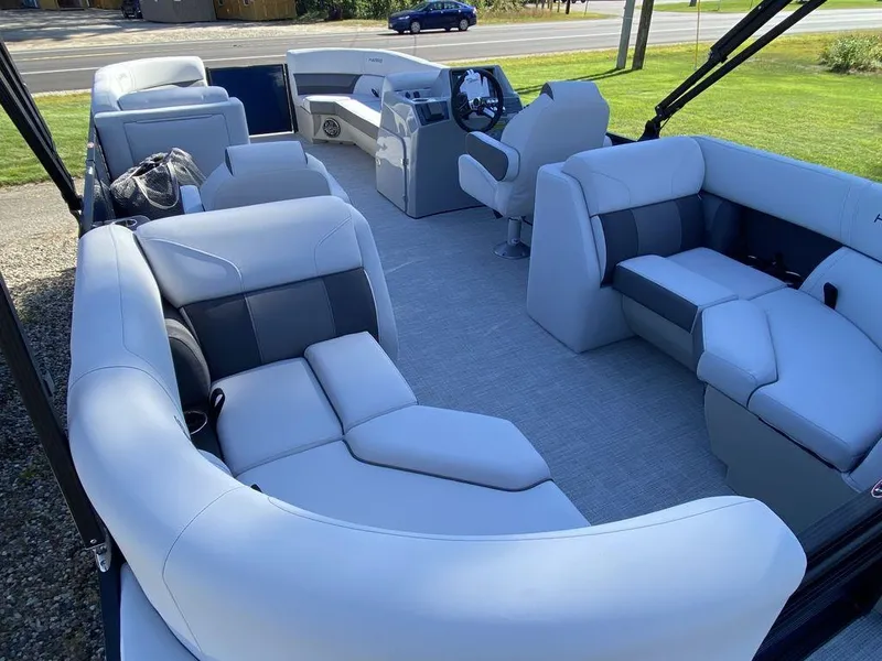 Slide: The Image of 2023 Harris Cruiser 230 CWDH pontoon boat interior with luxurious seating. - 7