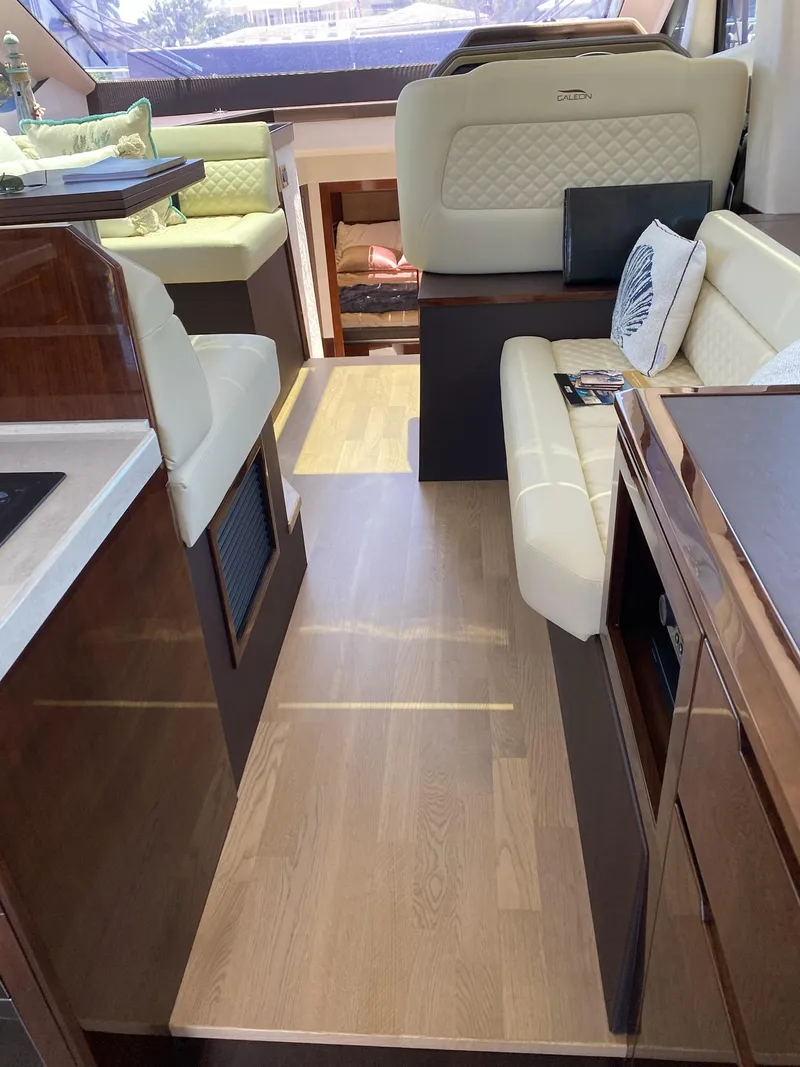 Slide: The Image of Luxurious interior of 2022 Galeon 470 Skydeck yacht with elegant seating and modern design. - 11