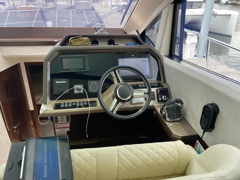 Slide: The Image of Interior helm of 2022 Galeon 470 Skydeck yacht with modern navigation equipment. - 13