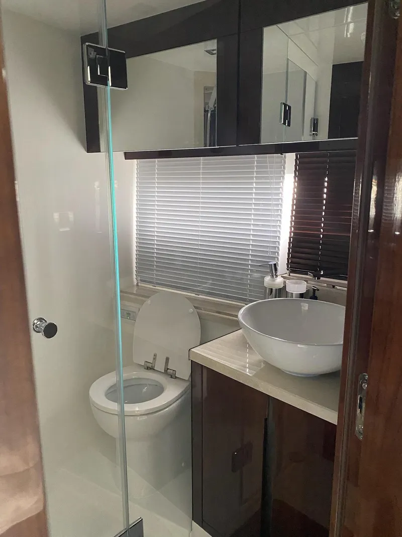 Slide: The Image of Modern bathroom in 2022 Galeon 470 Skydeck yacht with sleek fixtures and glass shower. - 14