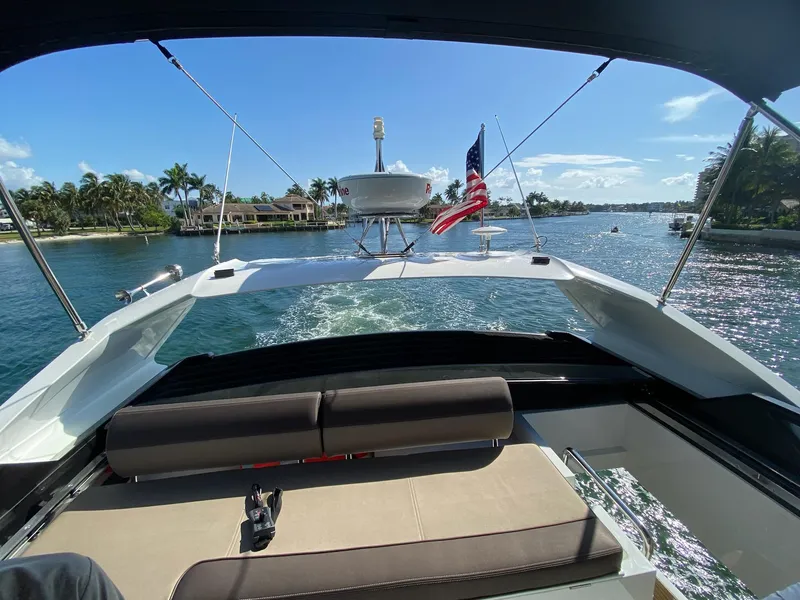 Slide: The Image of Galeon 470 Skydeck 2022 cruising on a sunny day with American flag. - 5