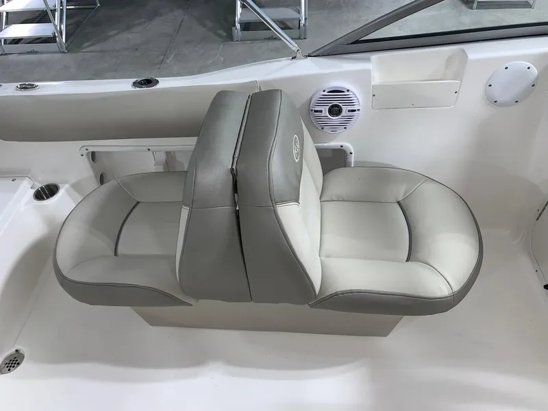 Slide: The Image of 2024 Key West 203 DFS boat interior seating with gray and white upholstery. - 11