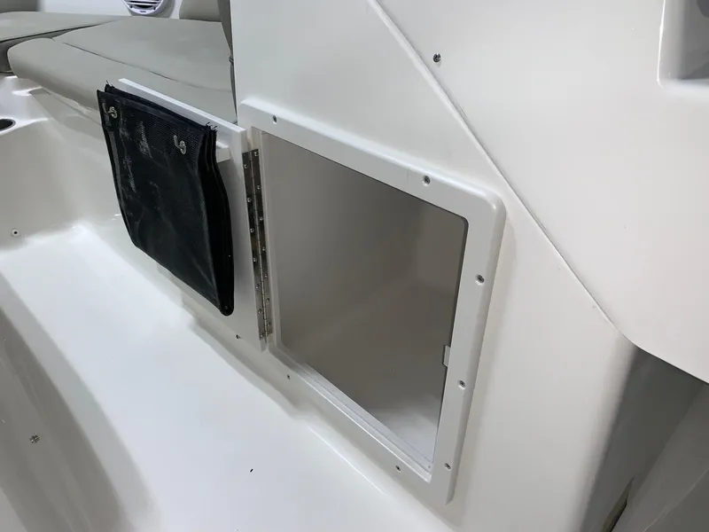 Slide: The Image of 2024 Key West 203 DFS boat storage compartment and seating area. - 5