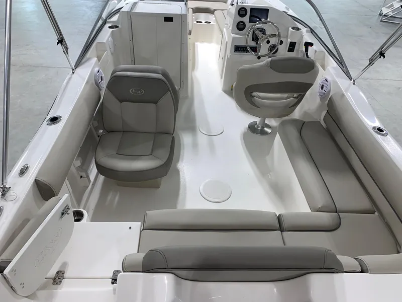 Slide: The Image of 2024 Key West 203 DFS boat interior with seating and steering console. - 4