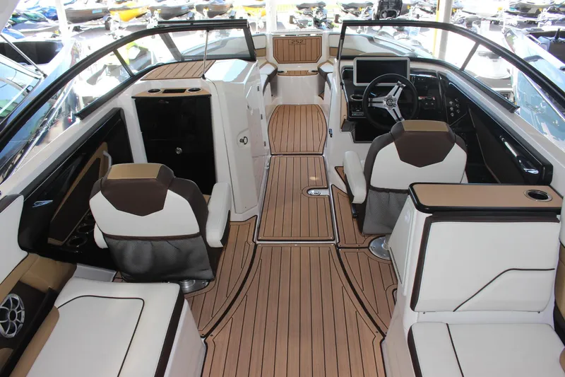 Slide: The Image of 2023 Yamaha Boats 252SE interior with luxurious seating and modern dashboard. - 3