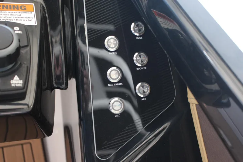 Slide: The Image of Control panel of 2023 Yamaha Boats 252SE with labeled buttons for various functions. - 7