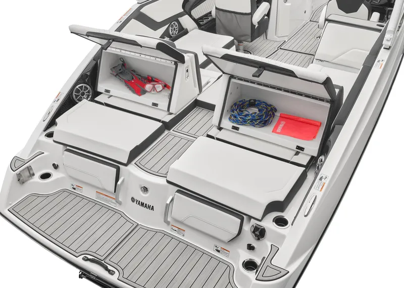 Slide: The Image of 2024 Yamaha Boats 252S with open storage compartments on the deck. - 3