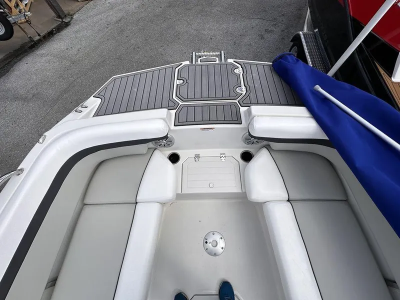 Slide: The Image of 2023 Starcraft SVX 191 boat interior with cushioned seating and non-slip flooring. - 3