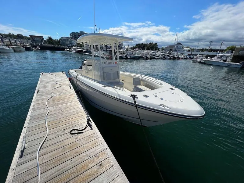 The Image of 2020 Mako 236 CC boat docked at marina under clear blue sky. - 0