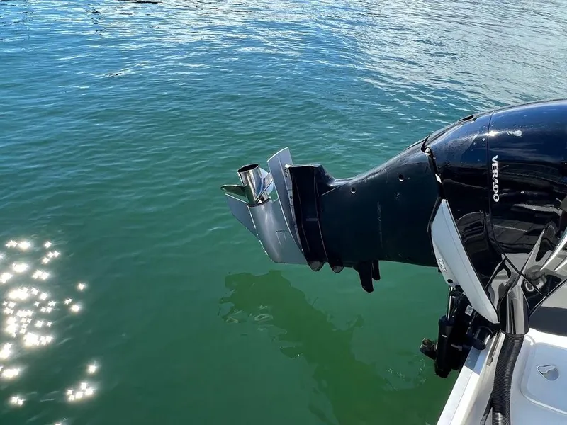 Slide: The Image of Mako 236 CC 2020 boat engine over clear water. - 8