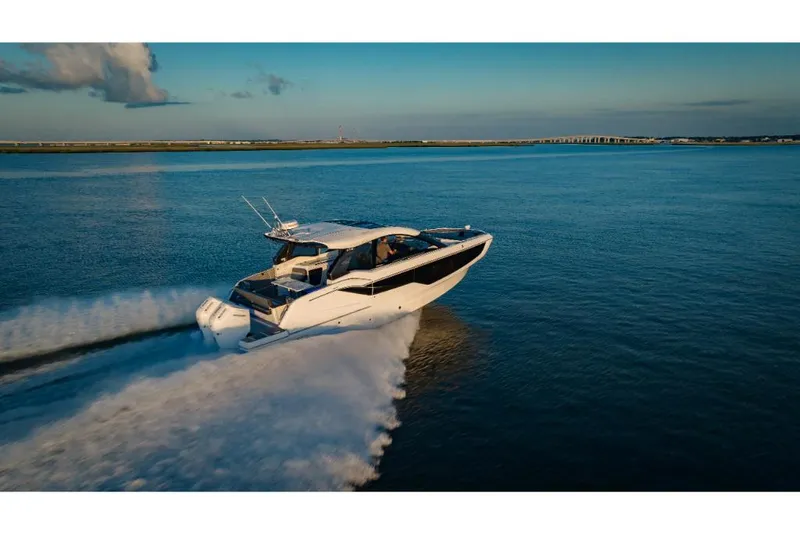Slide: The Image of 2023 Galeon 375 GTO luxury yacht cruising on open water. - 16