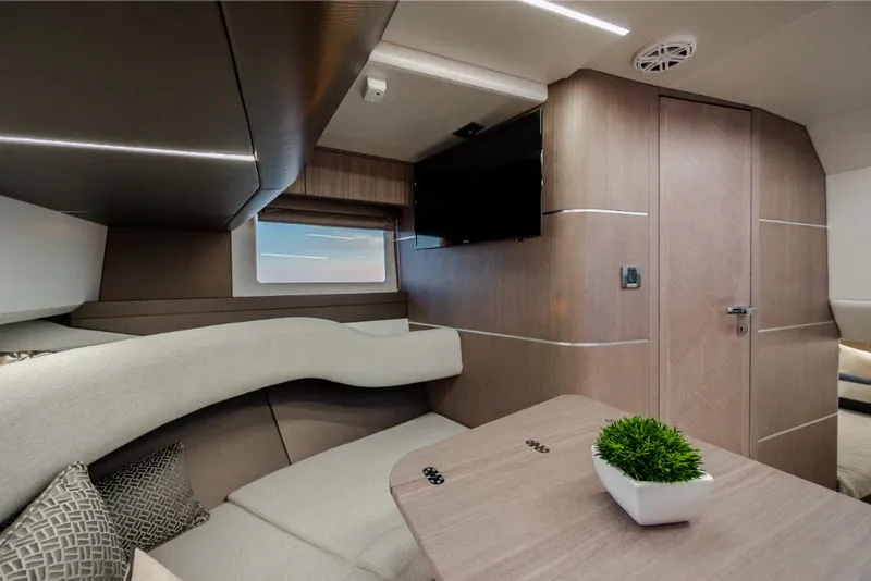 Slide: The Image of Luxurious interior of 2023 Galeon 375 GTO yacht with modern furnishings and a small plant. - 19