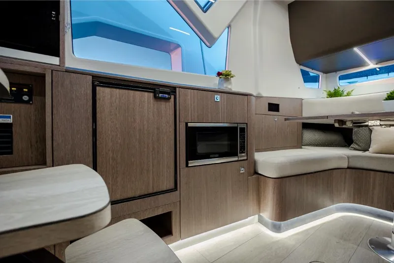 Slide: The Image of Interior of 2023 Galeon 375 GTO yacht with modern kitchen and seating area. - 20