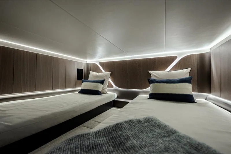 Slide: The Image of Modern cabin interior of 2023 Galeon 375 GTO yacht with twin beds and ambient lighting. - 22