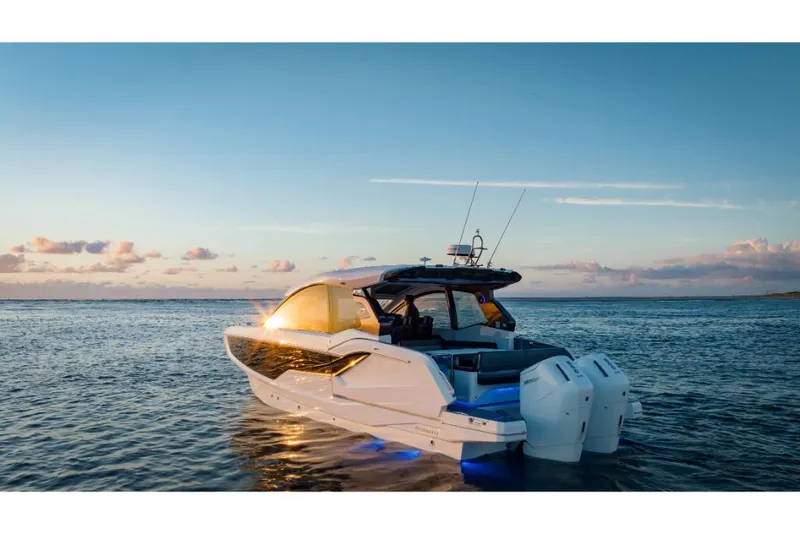 Slide: The Image of 2023 Galeon 375 GTO luxury yacht cruising at sunset. - 5
