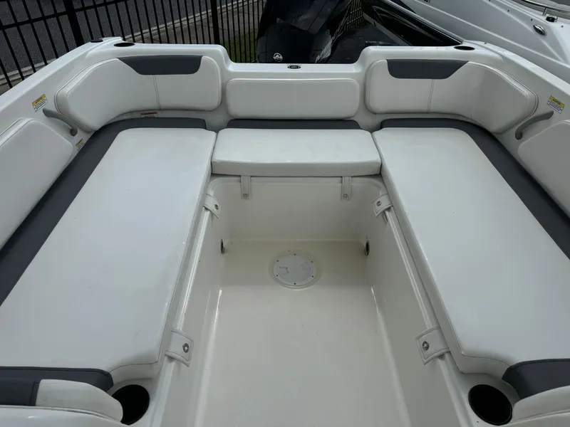 Slide: The Image of 2023 Bayliner E21 boat interior with spacious seating and modern design. - 3