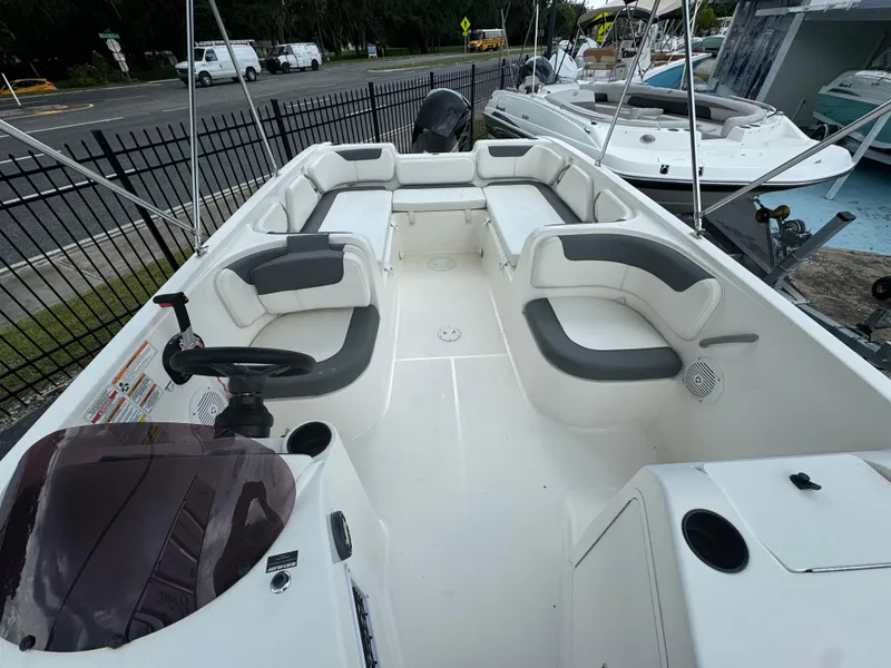 Slide: The Image of 2023 Bayliner E21 boat interior with spacious seating and modern design. - 6