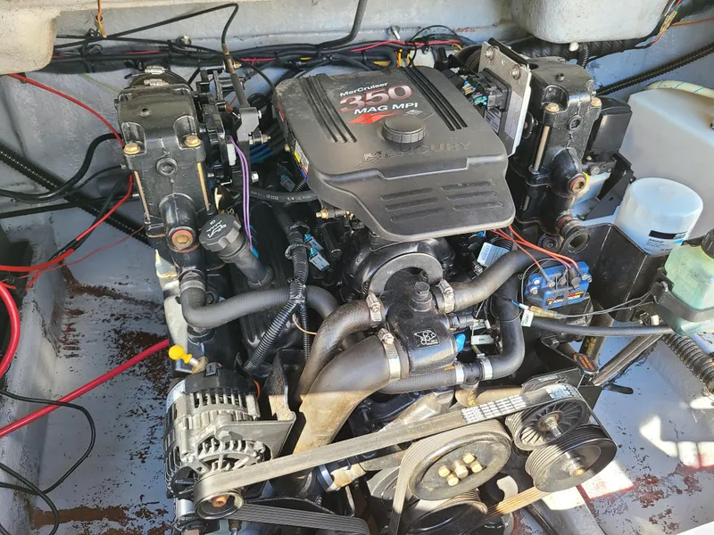 Slide: The Image of 2003 Crownline 230BR boat engine compartment with MerCruiser 350 MAG MPI engine. - 17