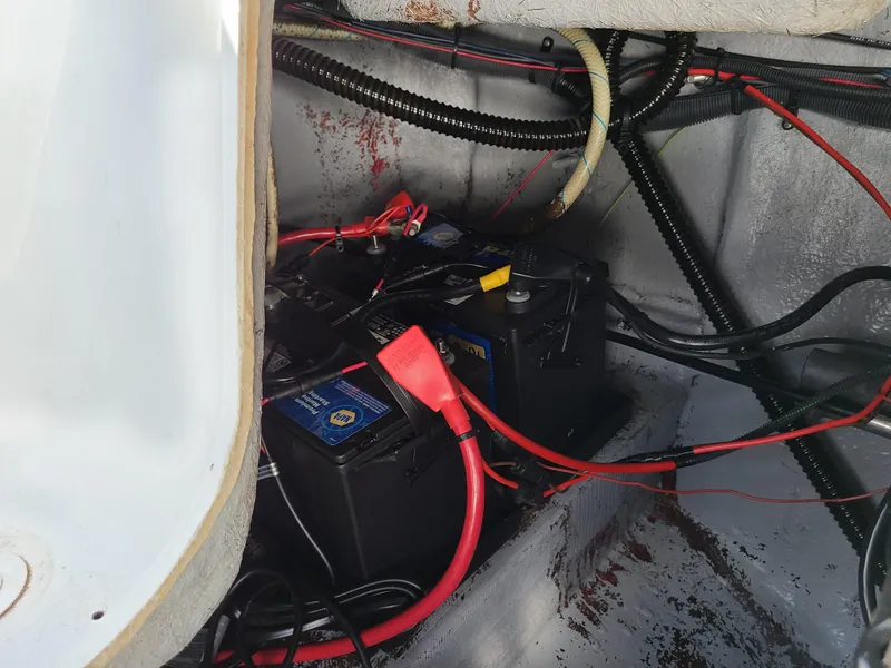 Slide: The Image of 2003 Crownline 230BR boat battery compartment with wiring. - 20