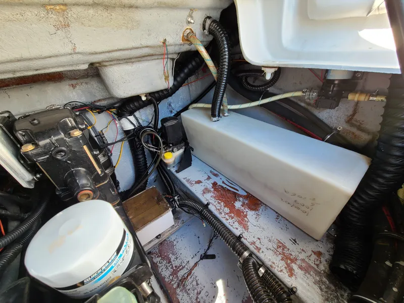 Slide: The Image of 2003 Crownline 230BR engine compartment with wiring and components. - 21