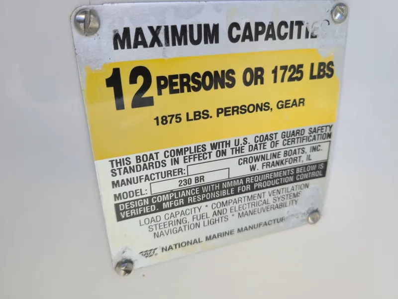 Slide: The Image of 2003 Crownline 230BR boat capacity plate, 12 persons or 1725 lbs, U.S. Coast Guard compliant. - 29