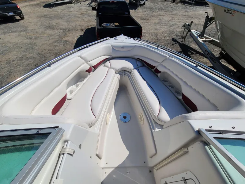 Slide: The Image of 2003 Crownline 230BR boat interior with white and red seating. - 8