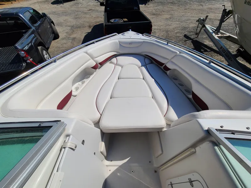 Slide: The Image of 2003 Crownline 230BR boat with white and red cushioned seating. - 9