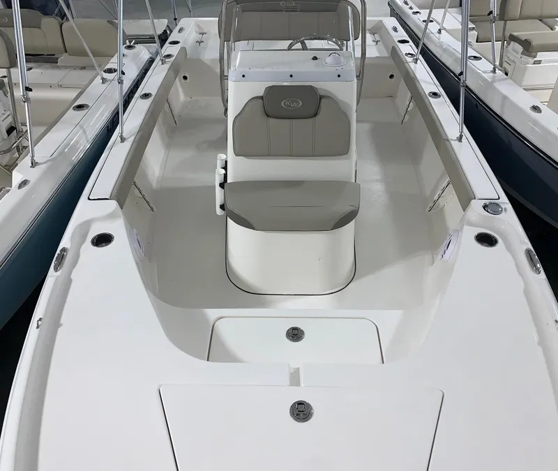 Slide: The Image of 2024 Key West 188 Bay Reef boat interior with seating and console. - 4