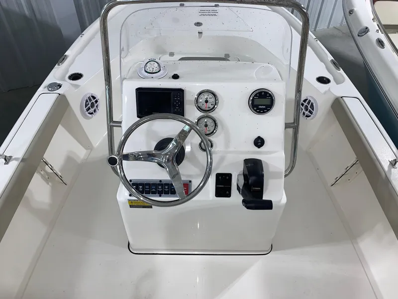 Slide: The Image of 2024 Key West 188 Bay Reef boat console with steering wheel and gauges. - 3