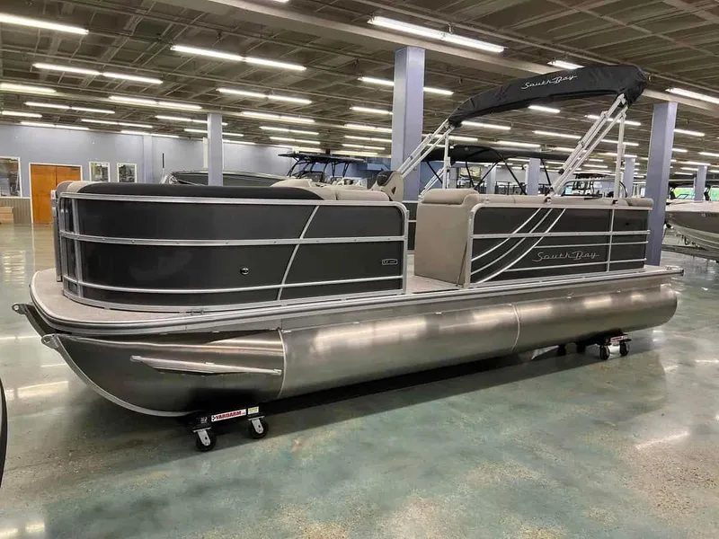 Slide: The Image of 2023 South Bay 222 CR LE 2.75 pontoon boat in showroom. - 1