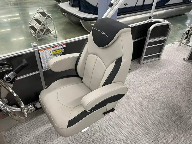 Slide: The Image of Captain's chair of 2023 South Bay 222 CR LE 2.75 pontoon boat, featuring luxurious upholstery. - 6