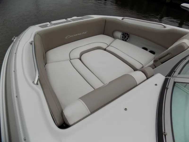 Slide: The Image of 2018 Crownline Eclipse E23 XS boat interior with beige seating and speaker. - 5