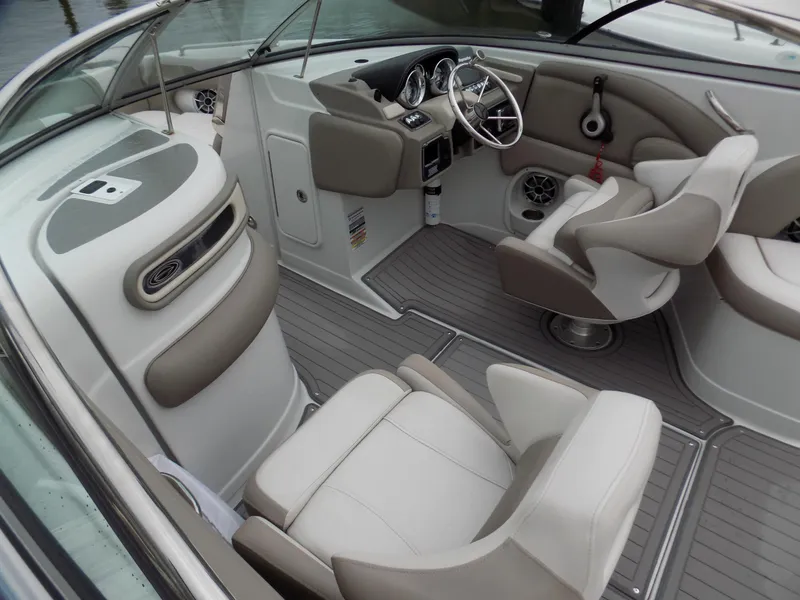 Slide: The Image of 2018 Crownline Eclipse E23 XS boat interior with modern seating and steering wheel. - 7