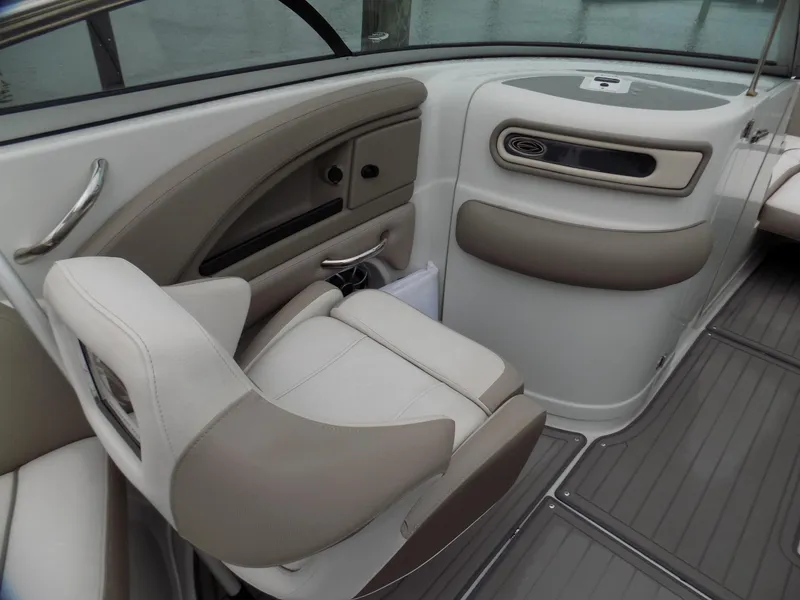 Slide: The Image of 2018 Crownline Eclipse E23 XS boat interior with beige seating and sleek design. - 8