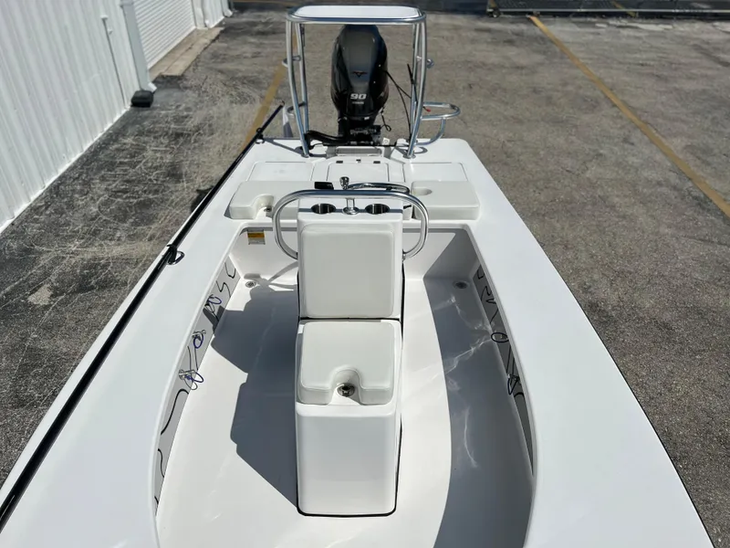 Slide: The Image of 2022 Xplor X7 boat on a trailer in a parking lot. - 6