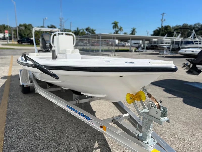 Slide: The Image of 2022 Xplor X7 boat console with steering wheel and controls. - 7