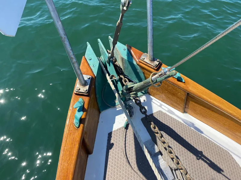 Slide: The Image of Bow of 2010 Laurent Giles Vertue Class Sloop with anchor and chain in sunlight. - 14