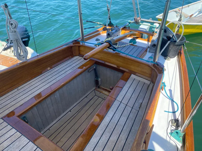 Slide: The Image of Laurent Giles Vertue Class Sloop, 2010 model, featuring a wooden deck and classic design. - 19