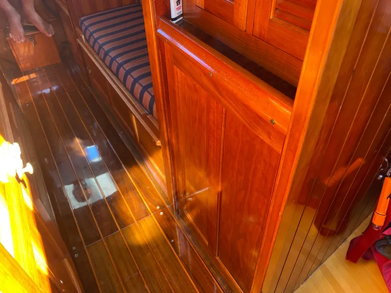 Slide: The Image of Interior of 2010 Laurent Giles Vertue Class Sloop with polished wood finish and striped seating. - 28