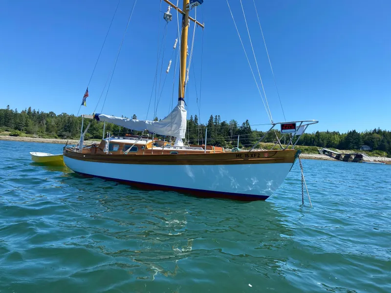 Slide: The Image of Laurent Giles Vertue Class Sloop, 2010, sailing on calm waters under clear blue sky. - 4