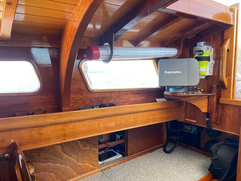 Slide: The Image of Interior of 2010 Laurent Giles Vertue Class Sloop with wooden finish and navigation equipment. - 43