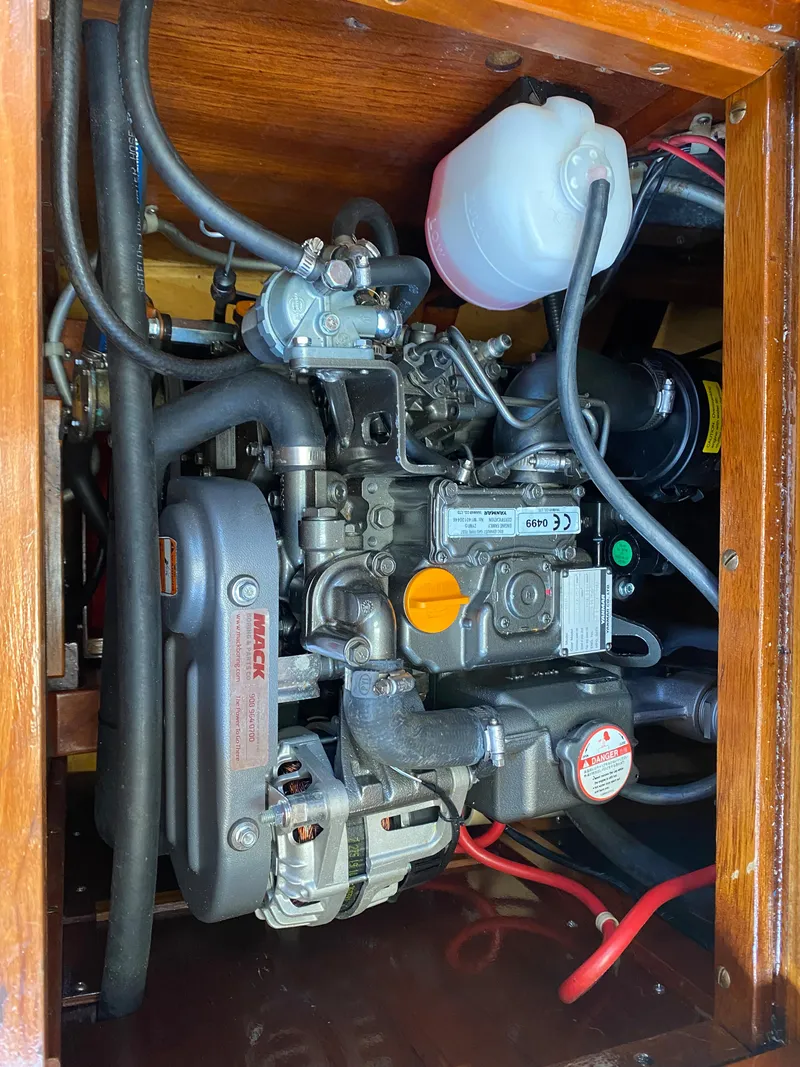 Slide: The Image of Engine compartment of a 2010 Laurent Giles Vertue Class Sloop, showcasing mechanical components. - 44